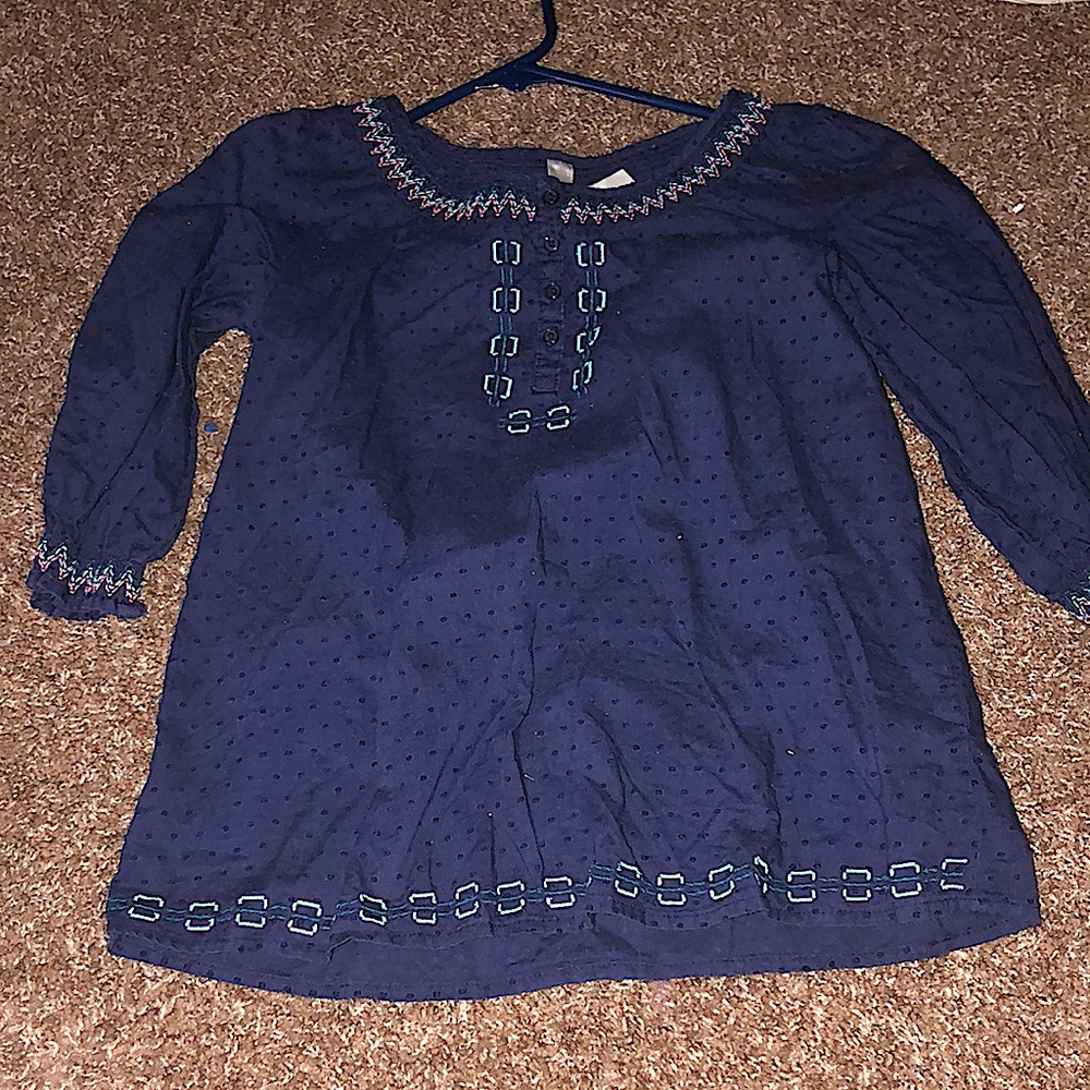 I am selling a Mexican girl shirt with half sleeves and lots of pardons.